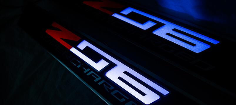 Black 2014-2019 C7 Corvette - Light Up Z06 SUPERCHARGED Replacement Door Sills 2Pc - Carbon Fiber w/Stainless Trim